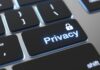 Apps That Are Essential for Your Privacy and Safety Online photo of a laptop keyboard with a key labeled with the word privacy