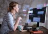 Why Budding Software Engineers Should Follow Industry Experts woman at her desk working as one of the software engineers
