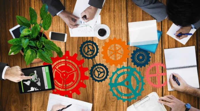 Adapting Asset Lifecycle Management to Remote Work Challenges people around a conference table working on asset lifecycle management