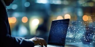 DNS Spoofing Exposed Navigating the Threat Landscape man in suit on laptop doing DNS spoofing