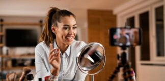 The End of the Influencer Brands Era? young woman speaking into her camera phone as one of many influencer brands