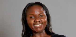 Fisayo Oluwadiya Feature headshot of Fisayo Oluwadiya with folded arms