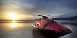 Steering Towards Success: Running a Jet Ski Rental Company red jet ski on a beach in the sunset at a jet ski rental