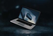 Using MacBook OS: Essential Tips for New Users a MacBook floating above the desk surface