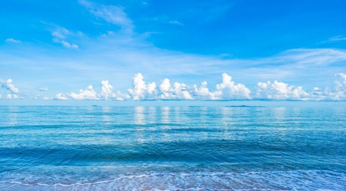 How IoT Innovations Are Curbing Plastic Pollution picture of ocean and clouds and how IoT is reducing plastic pollution