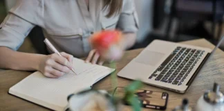 10 Types of Content That Brings More Traffic Person Writing On A Notebook Beside Macbook