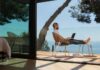 Navigating the Future of Remote Work: Embracing Trends & Technologies the future of remote work with a man sitting outside with his laptop overlooking the ocean