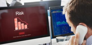 Risk Management Solutions for Business Owners young business owner working on the phone in risk management