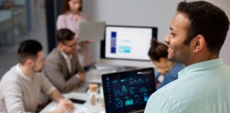 Top HR Software Solutions for Comprehensive Human Capital Management coworkers all working on a HR Software Solutions project