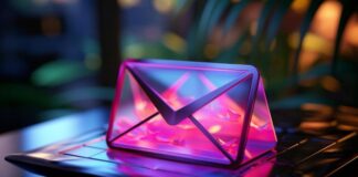 7 Key Benefits of Professional Email Hosting for Small Businesses 3D lit up email object sitting on laptop representing email hosting