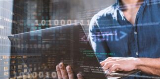 IT Support London: Why IT Support is Critical for Business technologist on a laptop providing IT Support