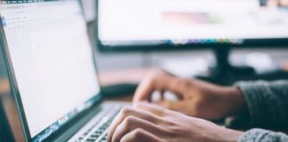 How To Ramp Up Traffic To Your Website man typing on laptop driving more traffic to your website