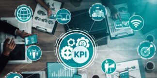 The Impact of Performance Measurement Software on KPI Management company team around a table working on performance measurement KPIs
