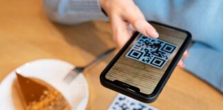 How Effective Are QR Codes in Retail Trade girl using QR codes in the retail trade