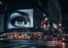 AdTech Services: Driving ROI Through Data-Driven Advertising A digital billboard using AdTech Services with a woman's eye