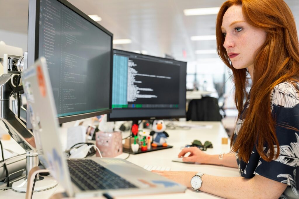 A woman at her desk working with industry-specific software