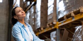 Why an OMS is the Heart of Inventory Management in Retail OperationsĀ Woman in warehouse using a laptop to assess the inventory management