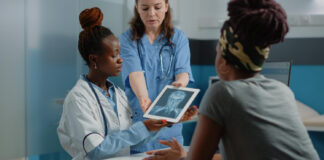 3 Great Ways To Grow Your Medical Practice & Get More Patients Doctor growing her medical practice by showing radiography diagnosis on digital device for healthcare examination to woman with disease.