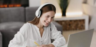 Evolution of Entrepreneurship: Online Education for Business Success Adult student learning through online education, sitting in front of a laptop and taking notes