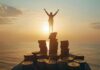 Maximizе Your Savings: Essеntial Tips for Financial Succеss a man maximized his savings standing atop a pile of bitcoin at a sunset