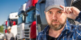 How To Optimize Your Fleet Workforce for Enhanced Operations driver with trucks and the fleet workforce behind him