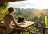 Remote Work Mastery: Essential Tools and Strategies for Success Remote worker at a tropical location on a laptop