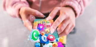 How to Optimize Your Product Videos on Different Social Media Platforms woman optimizing her product videos on her smartphone for social media