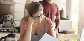 How to Build a Social Media Community for Frugal Living Woman working on finances for frugal living