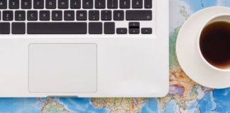 Eastern Europe as an Ideal Region for IT Outsourcing: Key Benefits Laptop on a world map to show IT outsourcing in Eastern Europe