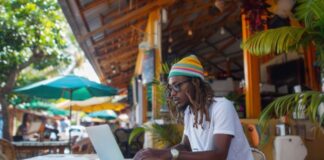 Pioneering Role of Fintech in Business: Wonga South Africa Case Study South African man using the pioneering role of fintech for his business on a laptop