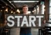 Guide to Starting a Business: Everything an Entrepreneur Should Know Young man holding a "start" sign for starting a business