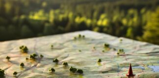 Unlocking the Power of Geofencing for Local Business Marketing paper map with pins in it to show geofencing for local business