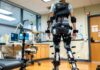 How Technology is Improving the Physical Therapy Industry Woman using robotic skeleton to walk in the physical therapy industry