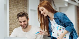 Pick the Right PPC Agency to Reach the Right Audience Today! man and woman working on a laptop at a PPC agency