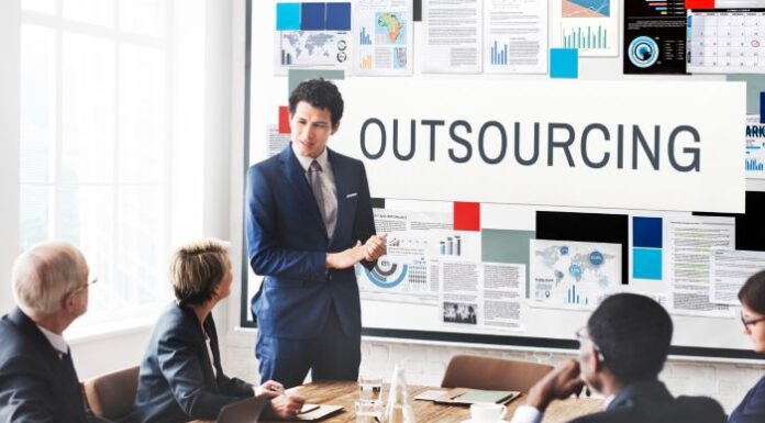 Boost Your Business Growth with Specialized Outsourcing Services Business team strategizing about specialized outsourcing