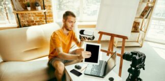 How to Build a Profitable Career as a Content Creator from Scratch A male content creator filming a review of a VR headset