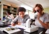 Balancing Homework in Science: Navigating Labs & Theories Effectively two students doing homework in science class