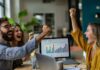 Understanding Marketing Attribution Models for Success Work team cheering because they used marketing attribution models