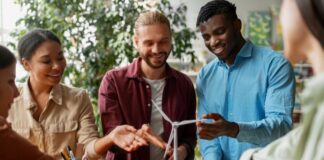 Achieving Sustainability Goals: The Role of Efficient Operations Tech people trying to achieve ambitious sustainability goals with a model wind turbine