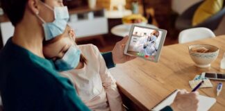 How Much Does It Cost to Develop a Telemedicine App: Price Breakdown a doctor on a telehealth call with a mother, to show develop a telemedicine app