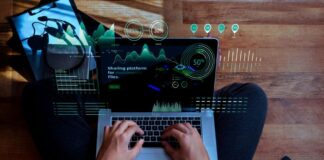 React Table Components: Revolutionizing Dynamic Data Interfaces programmer on laptop using dynamic data interface