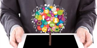 Top Improve-Memory Apps for Memory & Increased Cognitive Power man holding tablet with tree image for memory apps