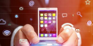 Trends in Mobile Application Personalization man holding smart phone with mobile application personalization