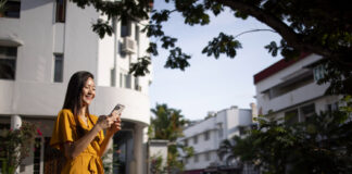 Residential vs. Mobile Proxies: Finding the Best Fit for Your Needs woman outdoors in the city using mobile proxies