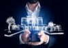 How Digital Technology Is Changing the Real Estate Industry Real Estate Industry Agent holding tablet with virtual house graphic