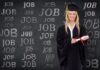 How CV-Lite Helps Recent Graduates Create Standout CVs Graduate in front of board with "job" on it, holding standout CVs