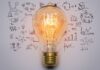 Redefining Entrepreneurship: Resilience, Differentiation, & Fulfillment a lightbulb with differentiation stats behind it