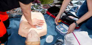 Using Tech to Aid in Emergencies: Modern First Aid and CPR students learning modern first aid and CPR