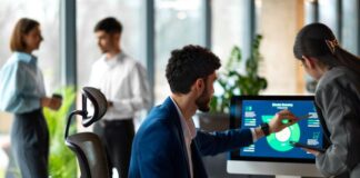 Artificial Intelligence as a Key Element of Sales Transformation sales transformation team using AI in an office