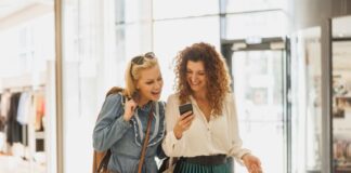How Values Shape Modern Shopping Habits two woman talking about values while shopping in the mall